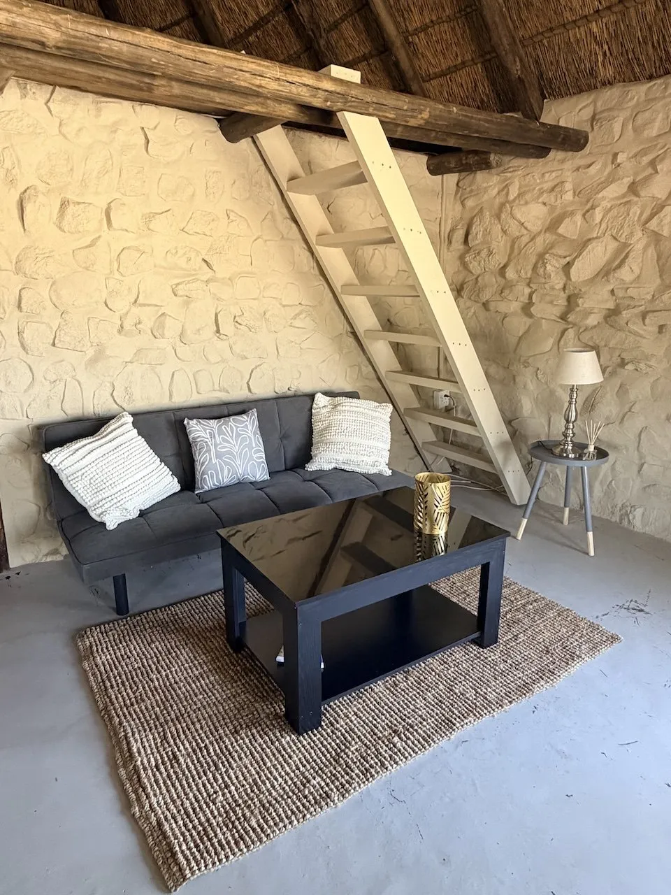 Lounge corner of the bungalow with sofa and coffee table